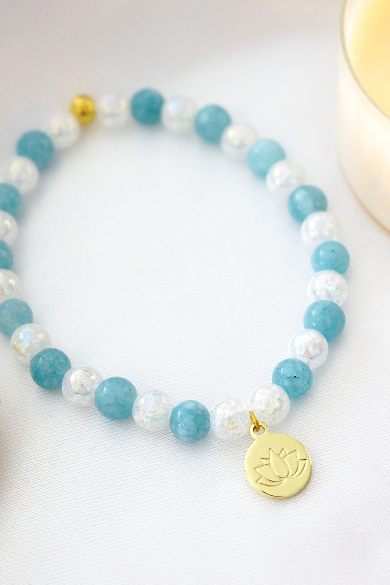 "Serenity & Light" – Aquamarine Elastic Bracelet with 24K Lotus Flower Charm