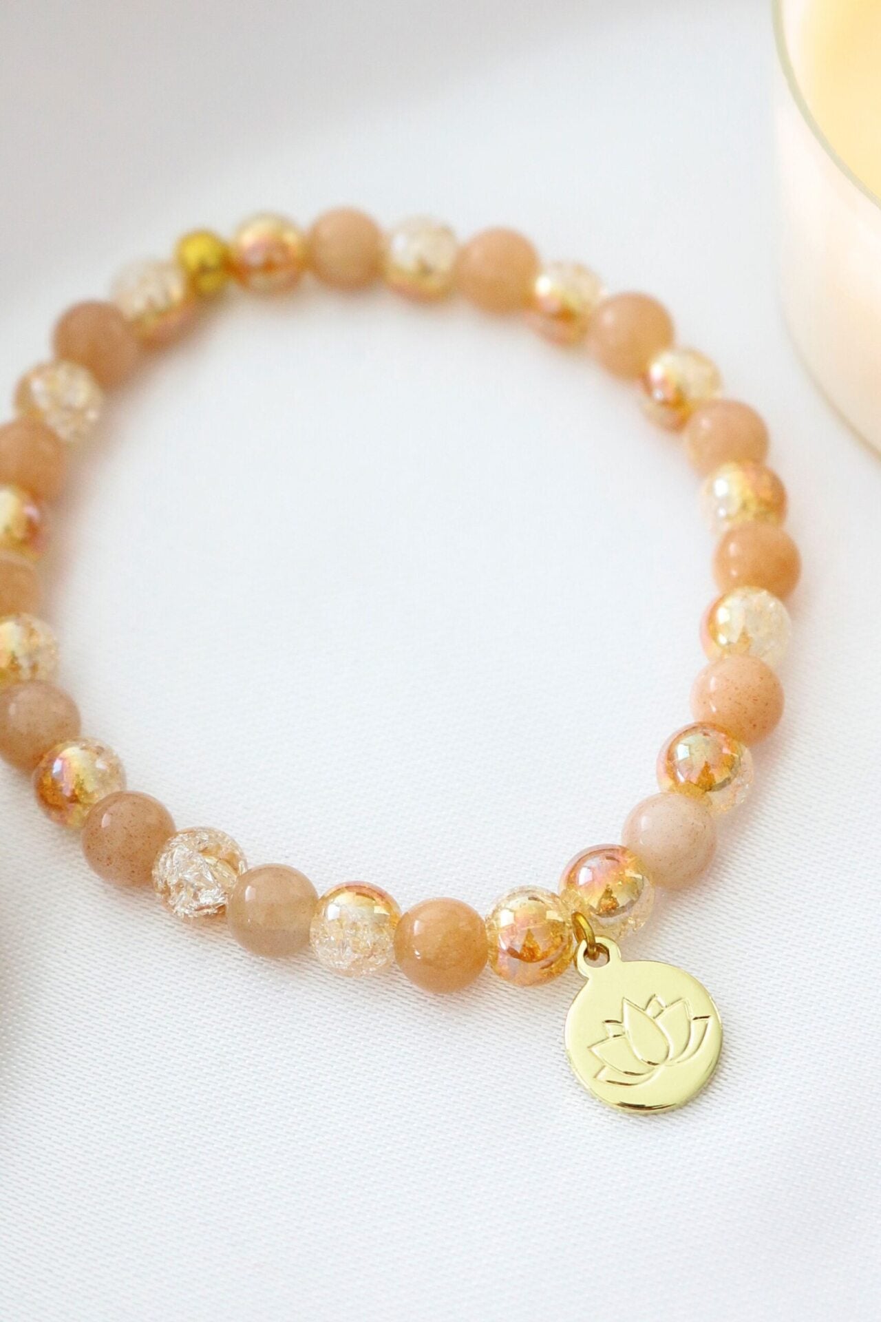 Sunstone Elastic Bracelet with 24K Gold Lotus Charm – A Symbol of Luck & Vitality